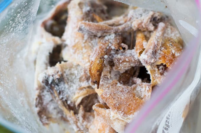 Frozen chicken bones in a ziploc bag.