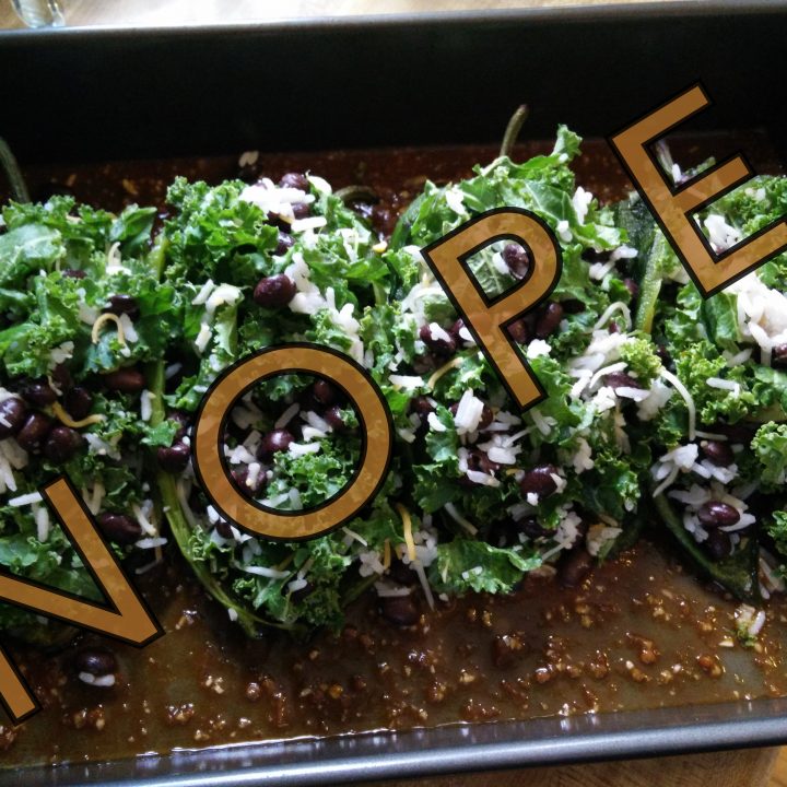 Title image of kale-stuffed peppers in a baking dish with overlay text.