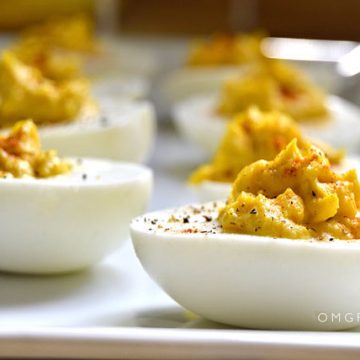 Closeup of deviled eggs on a plate.