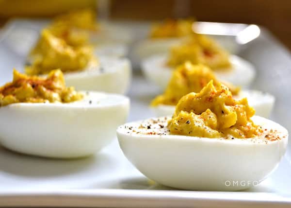 Closeup of deviled eggs on a plate.