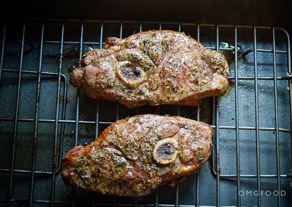 Lamb shoulder chops in a baking dish.