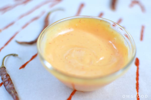 A closeup of sriracha aoili in a small bowl.