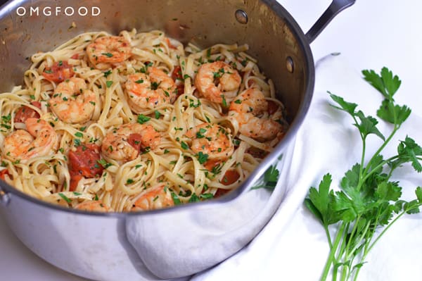 Shrimp scampi and linguine in a saucepan.