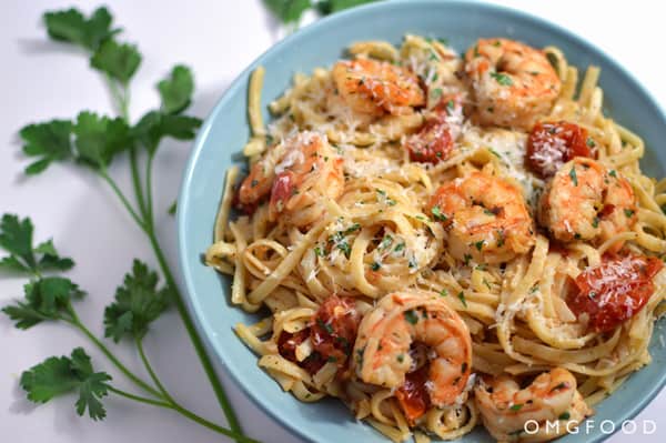 Shrimp scampi and pasta on a plate.