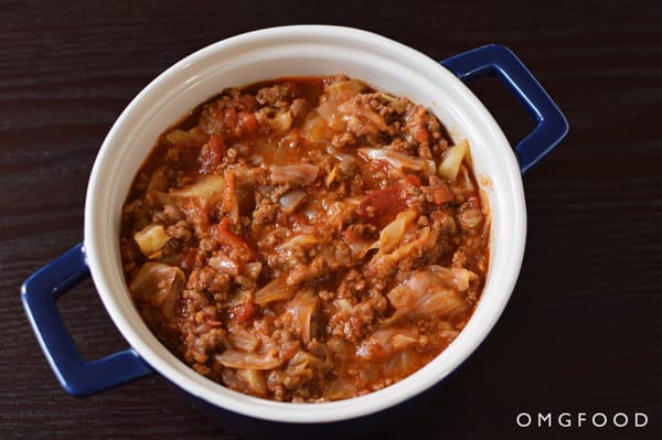 Closeup of unstuffed cabbage in a small dutch oven.