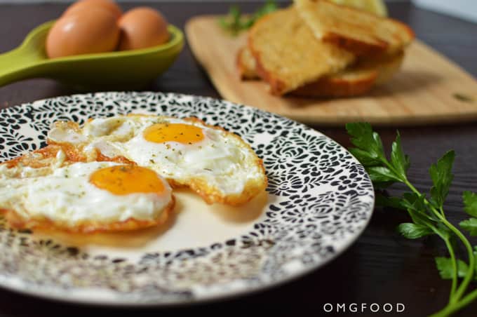 Closeup of fried eggs on a plate.