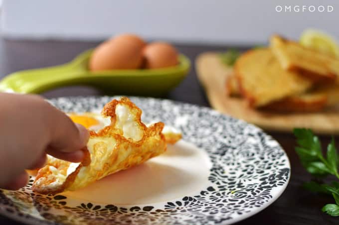 Crispy fried egg on a plate.