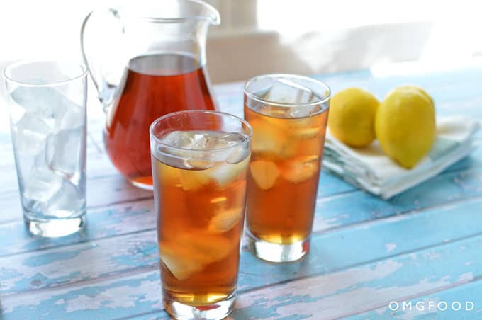 A pitcher and glasses of iced tea.