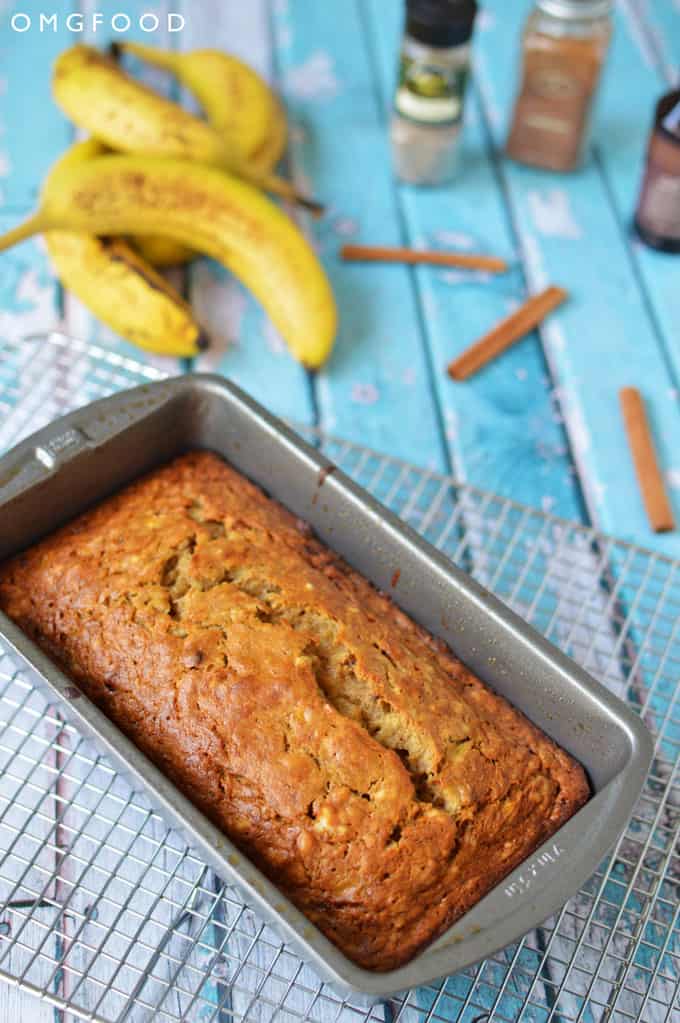 A baked banana bread in a loaf pan.