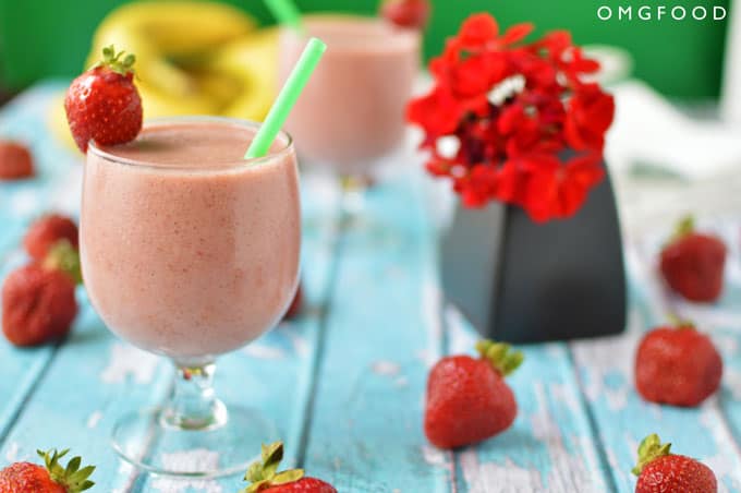 A closeup of a strawberry smoothie in a drinking glass.