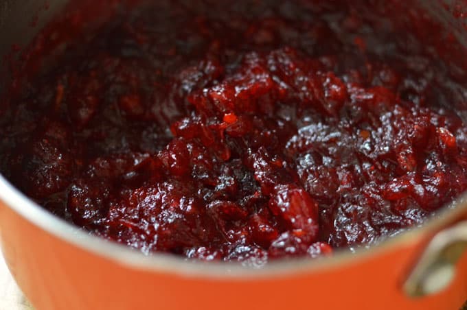 A closeup of cranberry jelly in a saucepan.