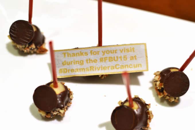 A platter of chocolate with a welcome banner.