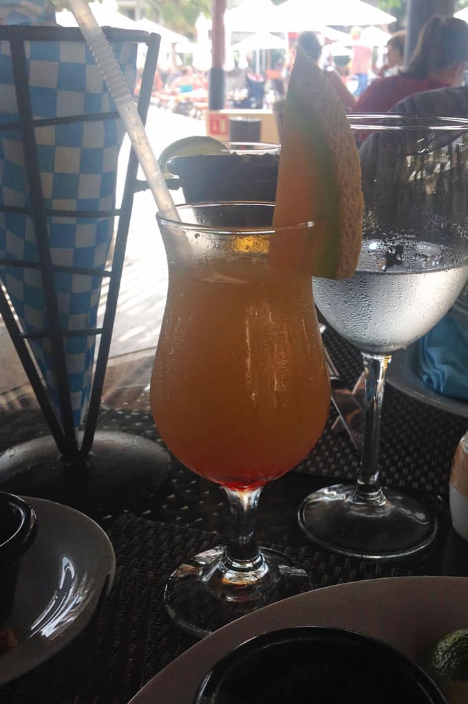 A closeup of a tropical fruit drink on a table.