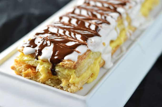 Closeup of mille feuille on a platter.