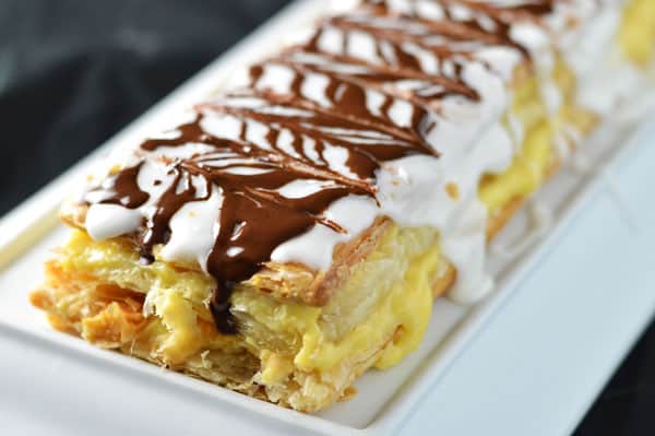 Closeup of mille feuille on a platter.