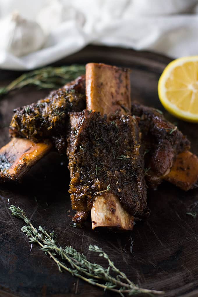 Roasted beef ribs on a platter.