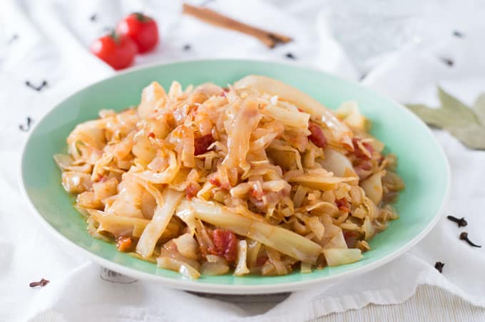 A plate of cooked shredded cabbage.