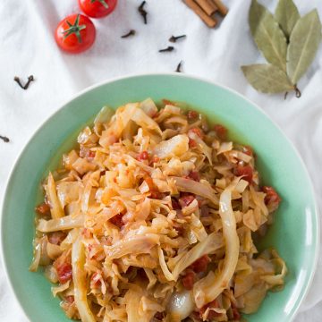 A plate of cooked shredded cabbage.