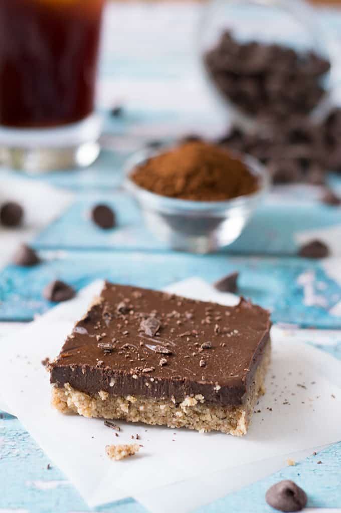 A slice of a chocolate pie bar on a parchment square.