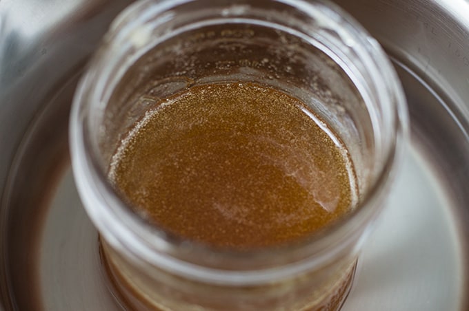 Close up of a jar of decrystallized honey.