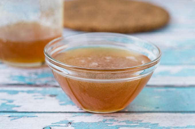 Close up of honey in a small bowl.