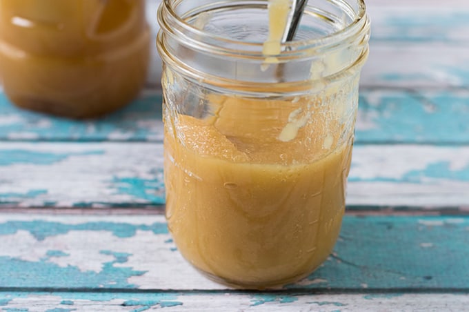 A glass mason jar of crystallized honey.