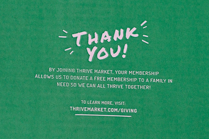 A green thank you sign with white text.