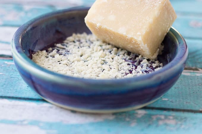 Grated cheese in a small dish.