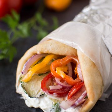 Closeup of a zucchini and tinkerbell pepper wrap.