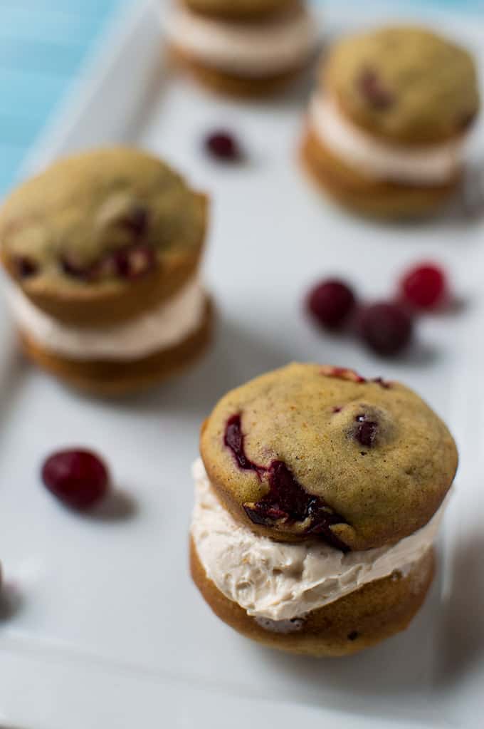 Close up of pumpkin whoopie pies on a plate.