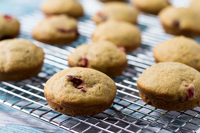 Miniature cakes on a baking rack.