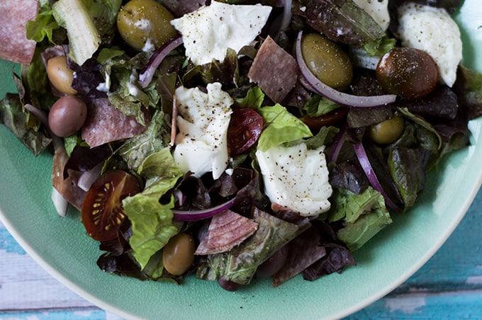 Closeup of buffalo mozzarella and salami salad.