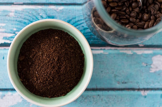 Close up of ground coffee in a small bowl.