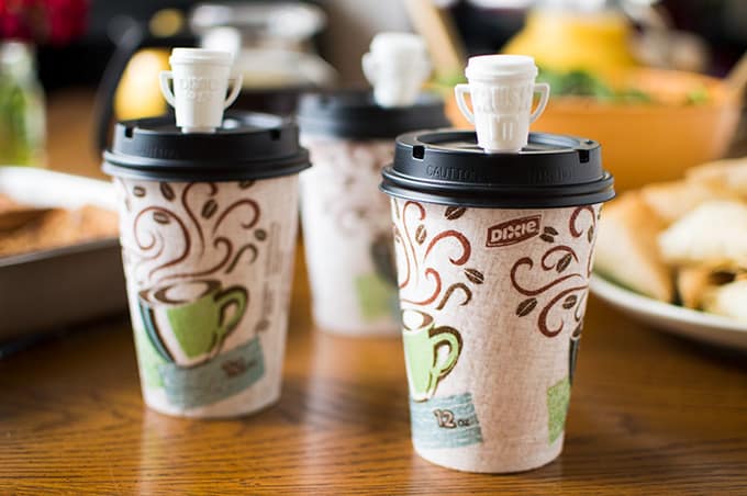 Closeup of paper coffee cups on a table.