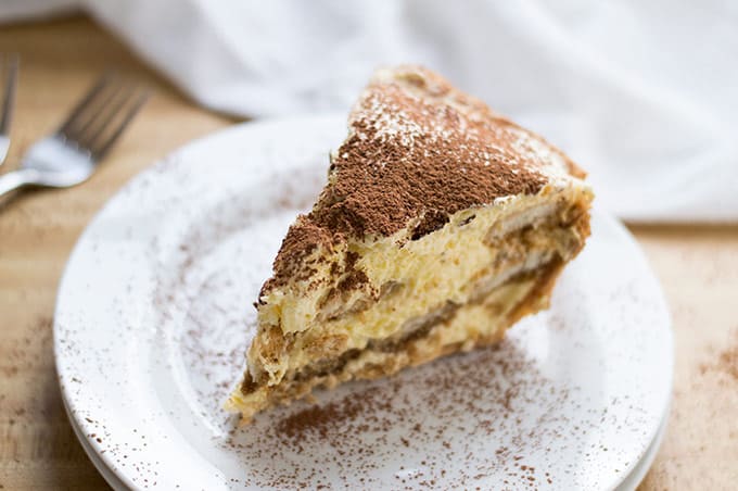 Close up of tiramisu pie on a plate.