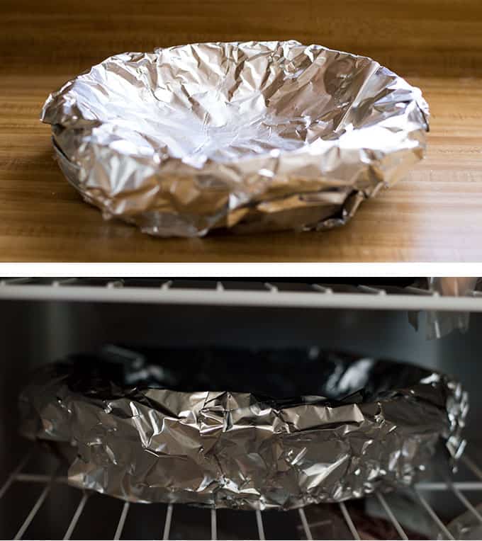 An aluminum foil-wrapped pie pan.