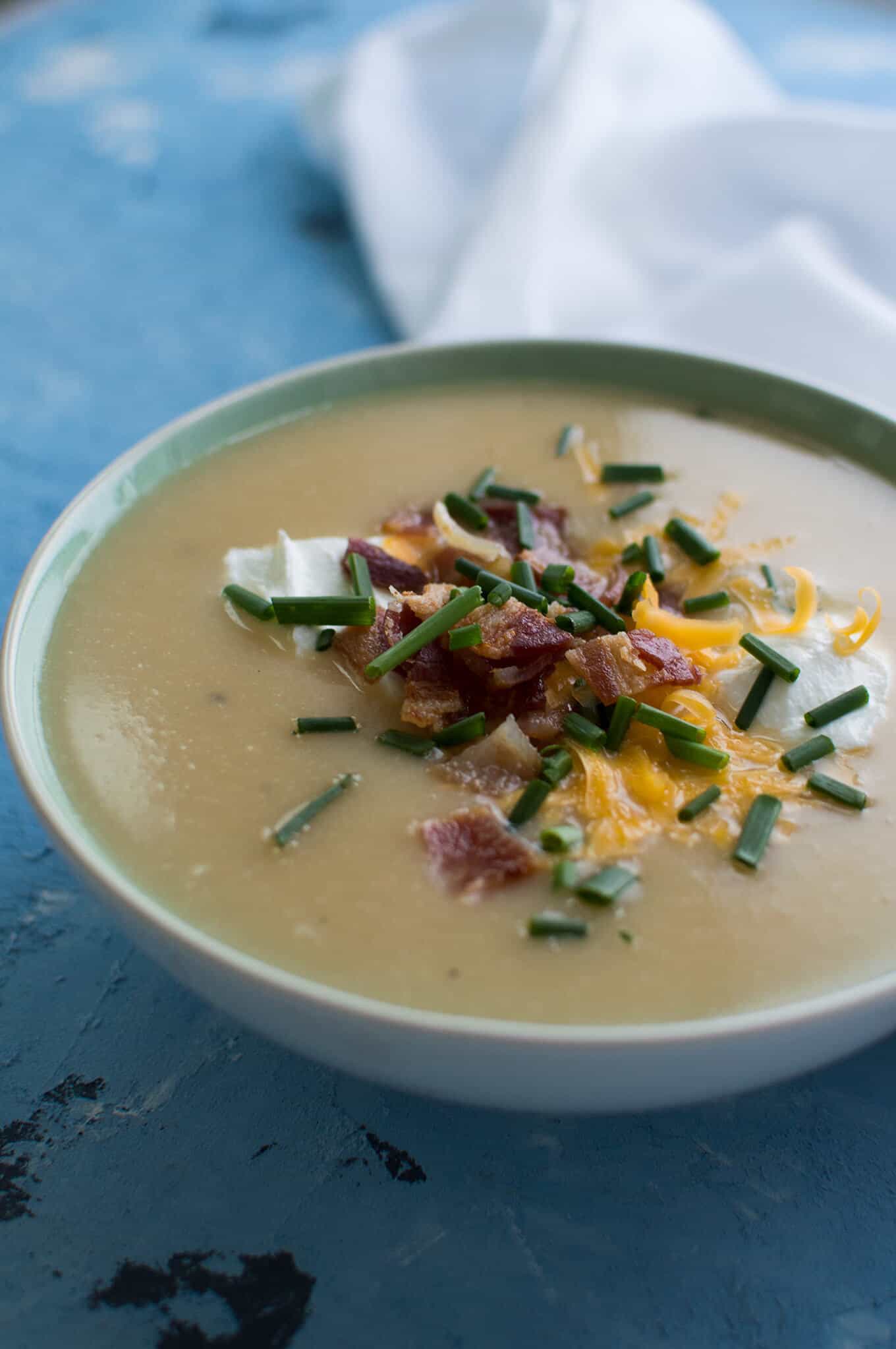 Close-up of cauliflower and potato soup in a bowl.