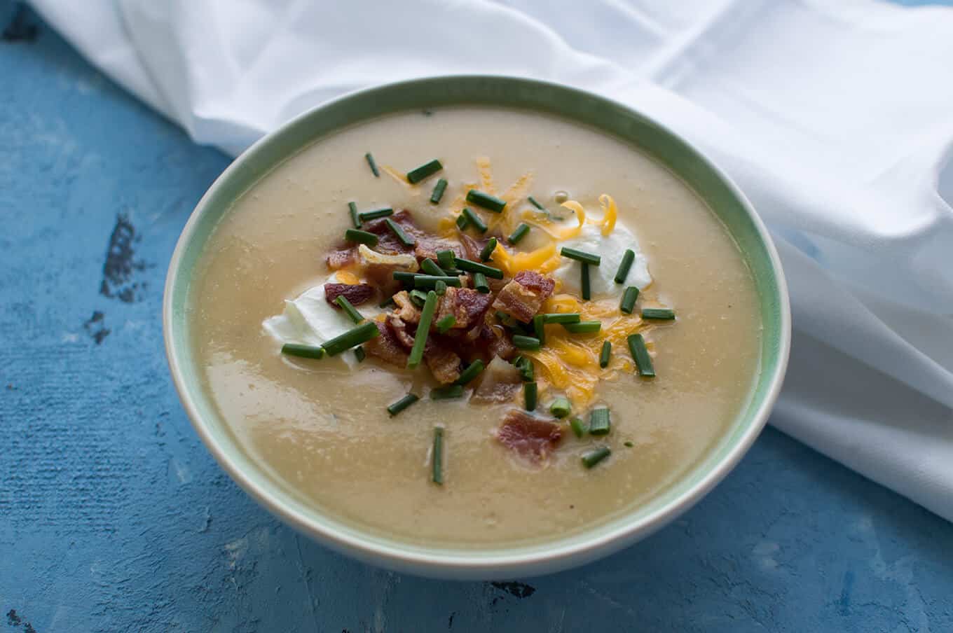 A bowl of cauliflower and potato soup.