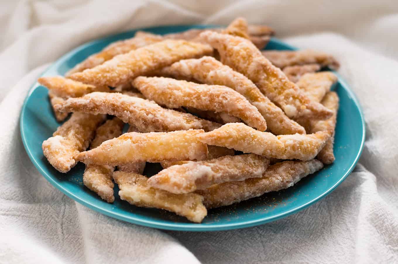 A plate of Trinidadian kurma on a blue plate.