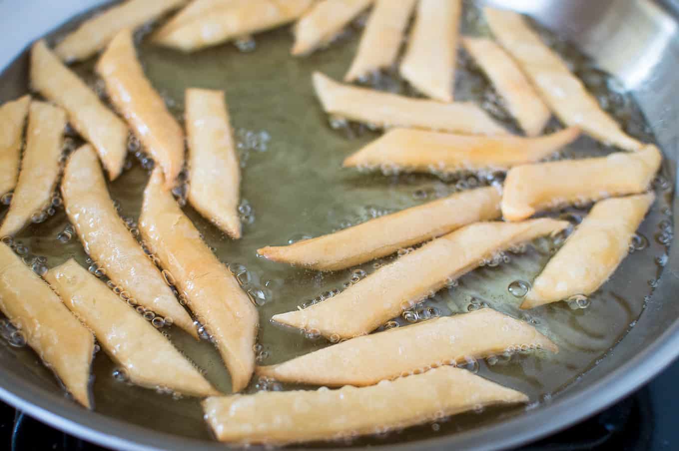 Trinidadian kurma being fried in oil.