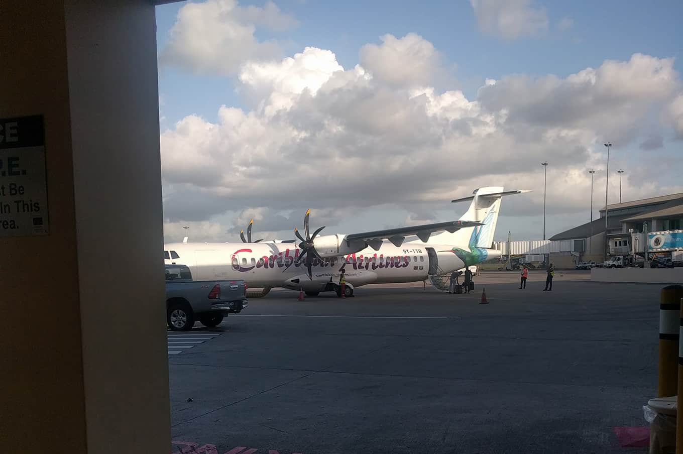 A airplane that is parked on the side of an airport runway.