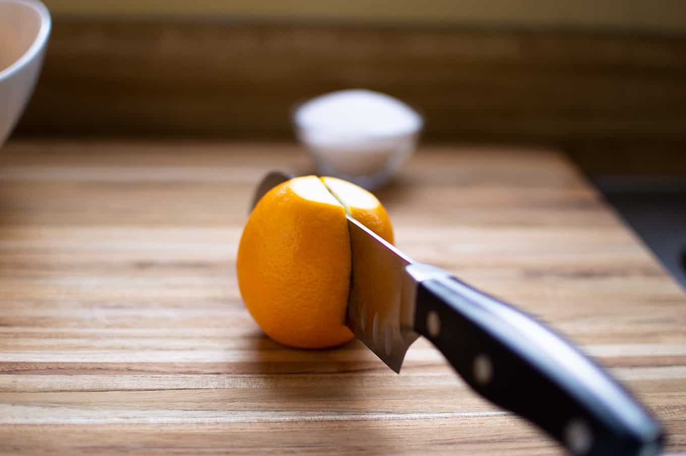 A knife cutting through a lemon.