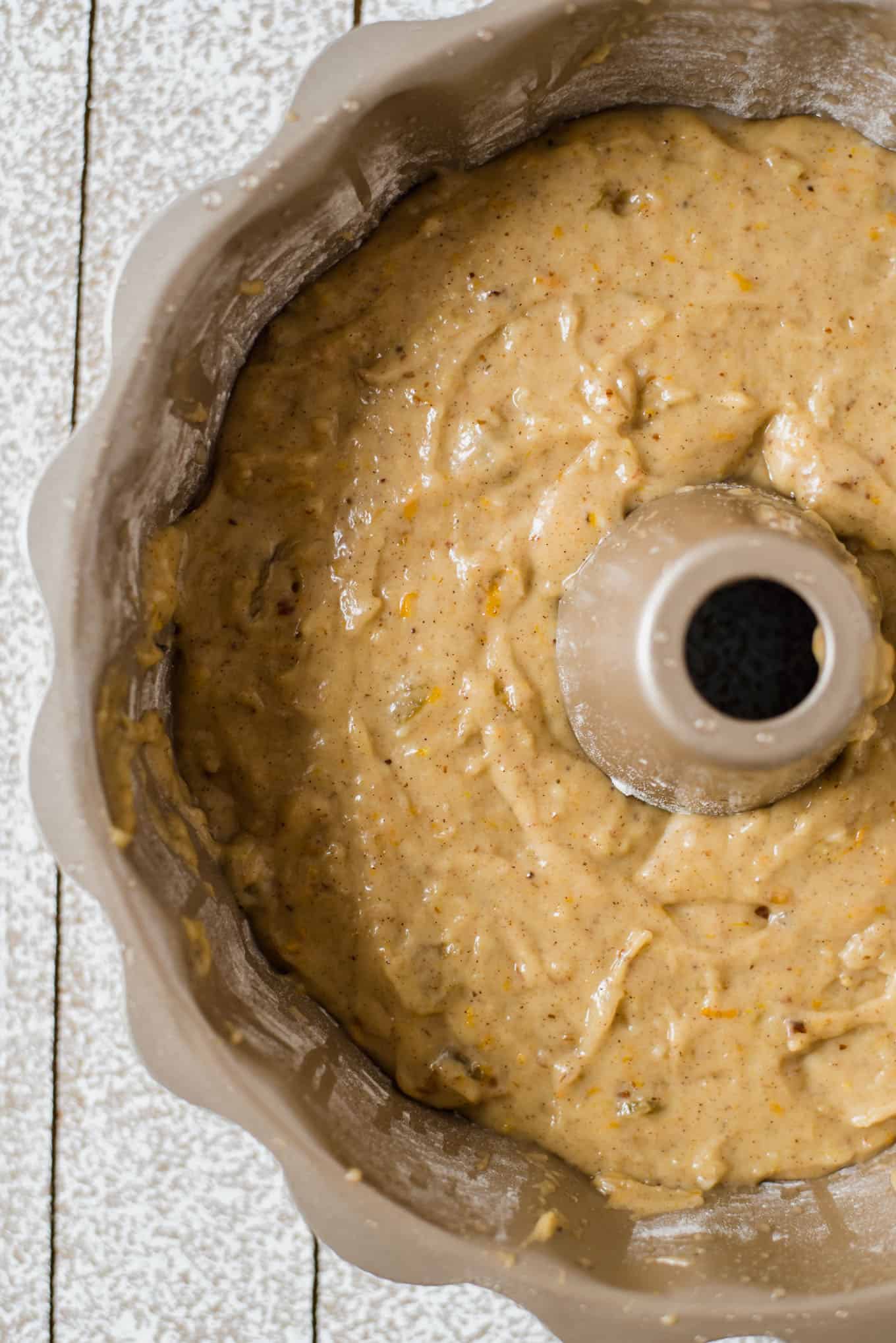 A close up view of fanouropita batter in a bundt pan.