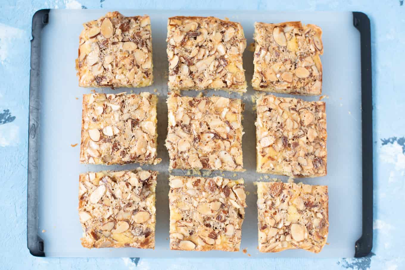 Top-down view of Swedish visiting cake bars resting on a cutting board.