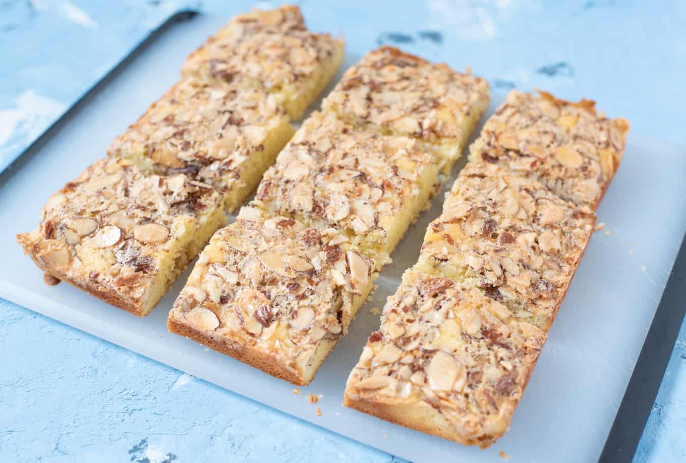 Swedish visiting cake bars resting on a cutting board.