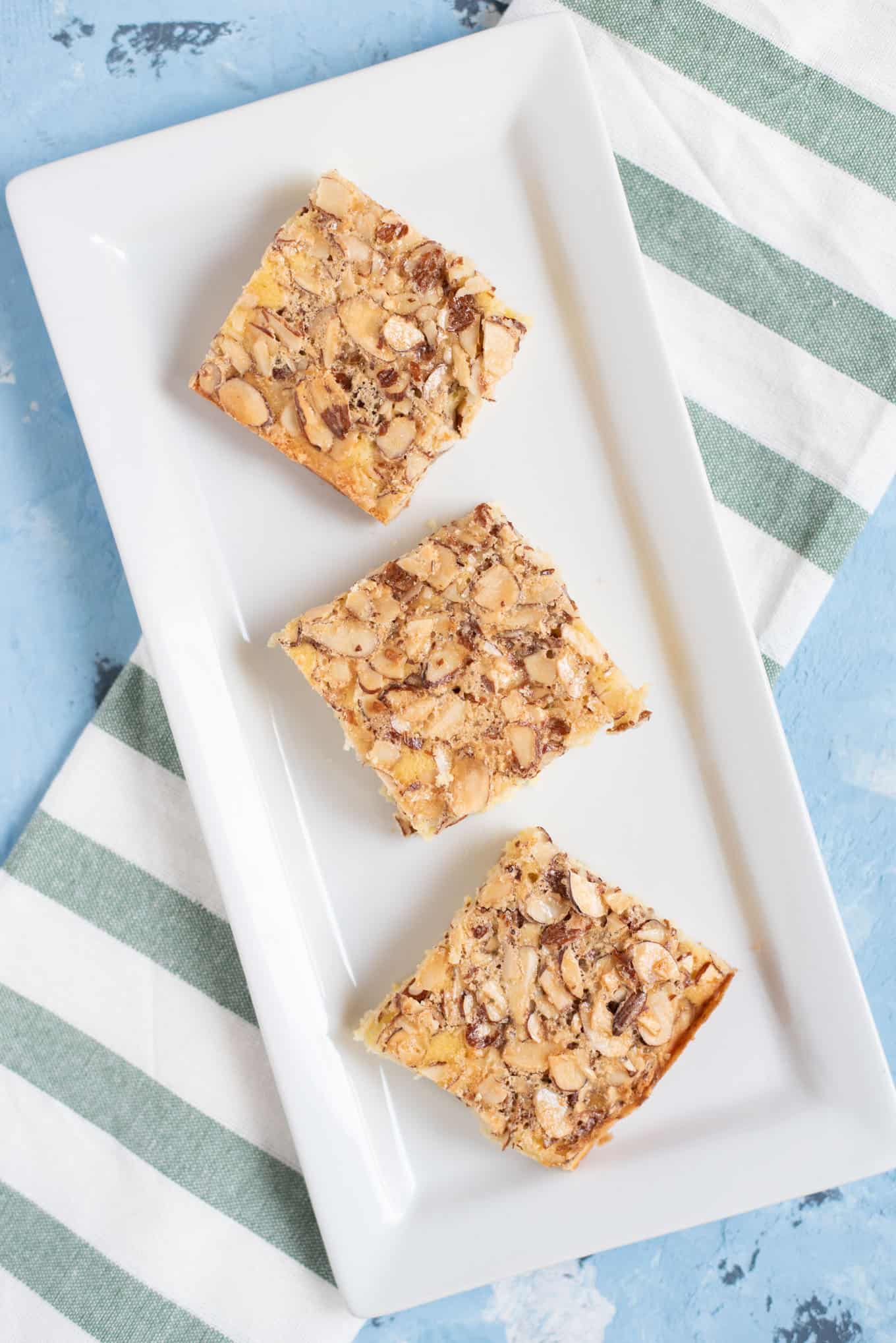 A rectangular plate of three Swedish visiting cake bars.