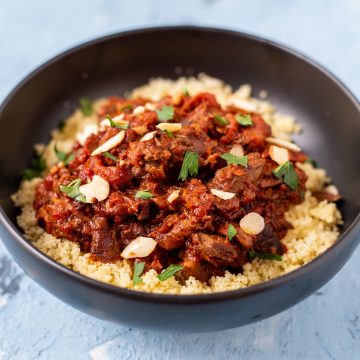 A close-up of lamb tagine in a bowl.