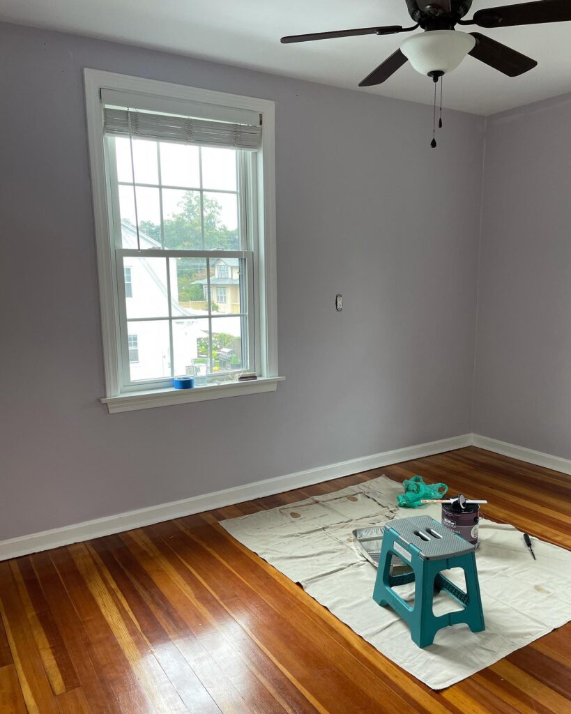 An empty bedroom with gray walls.