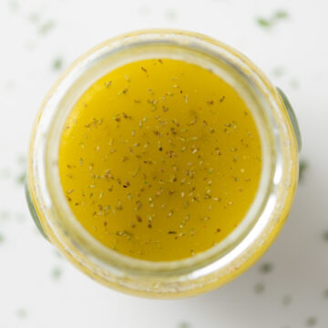 Closeup of ladolemono dressing in a jar.